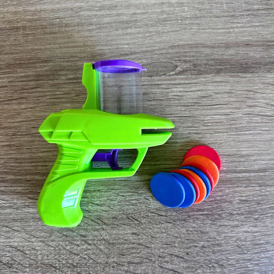Mini pistola lanzadora de discos